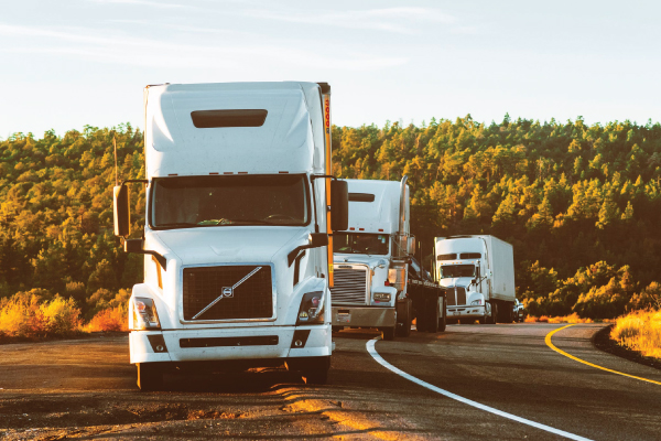 three cargo trucks