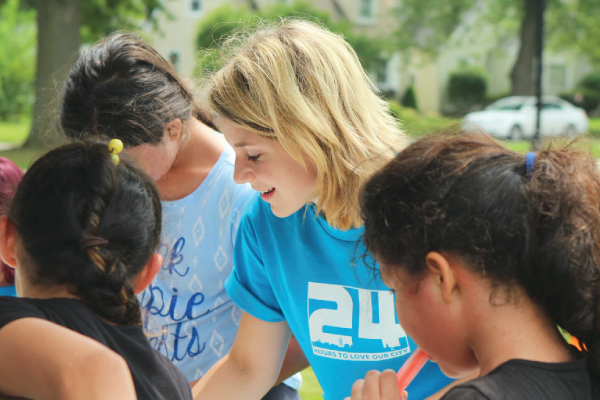 volunteer helping kids